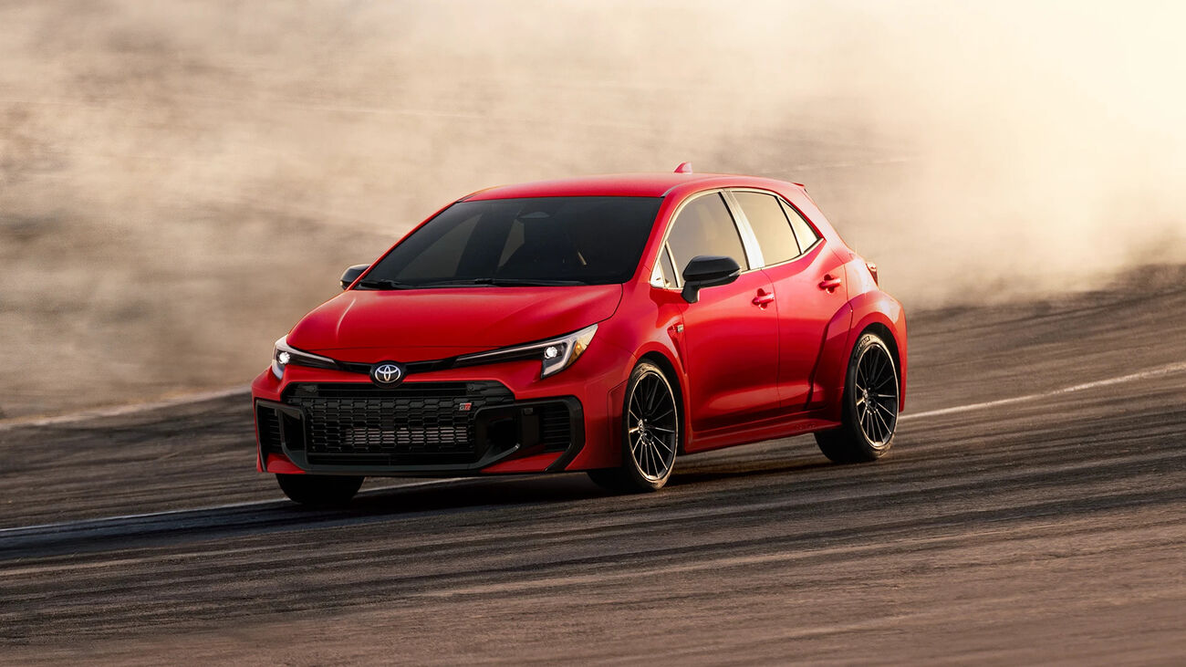 GR Corolla in Supersonic Red speeding down a race track